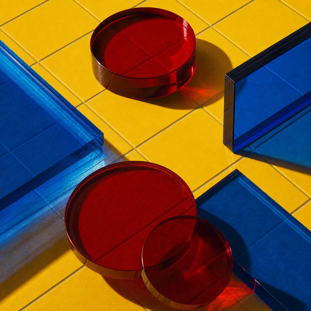 Ruby discs and cobalt glass panes arranged on a yellow grid